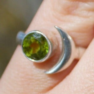 Sterling silver gemstone ring featuring an elegant moon embellishment